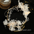 Elegantes accesorios para el cabello nupcial diadema de flores blancas